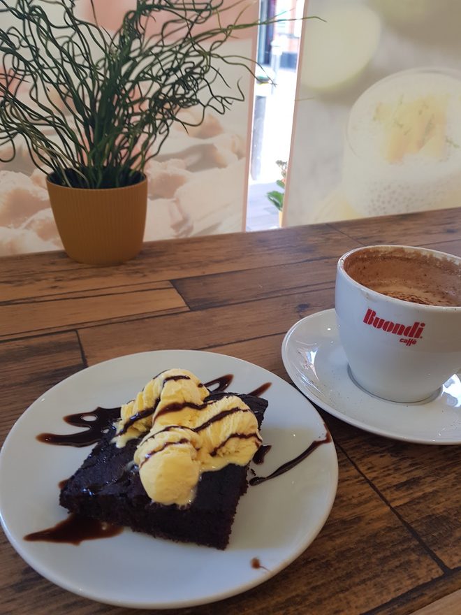 Chocolate cake and coffee on a wooden table